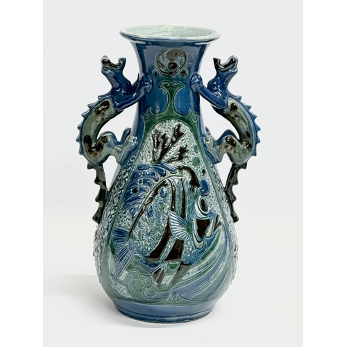 15 - An early 20th century C.H. Brannam Barum Ware glazed pottery vase designed by Frederick Bowden. 1905... 