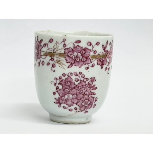 219 - An 18th century Lowestoft porcelain coffee cup. Circa 1760-1780. 8x6x6.5cm