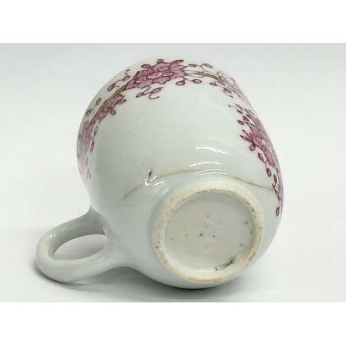 219 - An 18th century Lowestoft porcelain coffee cup. Circa 1760-1780. 8x6x6.5cm