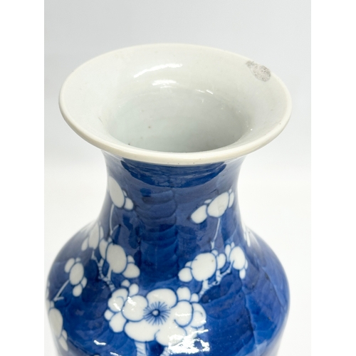 223 - A late 19th century Chinese blue and white prunus baluster vase. Guangxu (1875-1908) 26cm