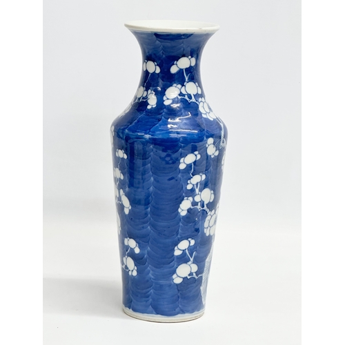 223 - A late 19th century Chinese blue and white prunus baluster vase. Guangxu (1875-1908) 26cm