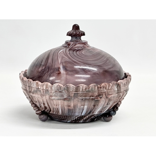 171 - 2 pieces of late 19th century ‘Slag Glass’ . Circa 1890-1900. A powder jar with lid 14x12cm and a ju... 