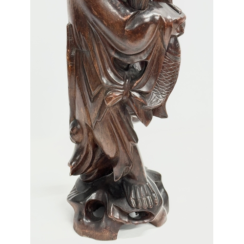 231 - A large early 20th century Chinese carved fisherman figure lamp. 59cm