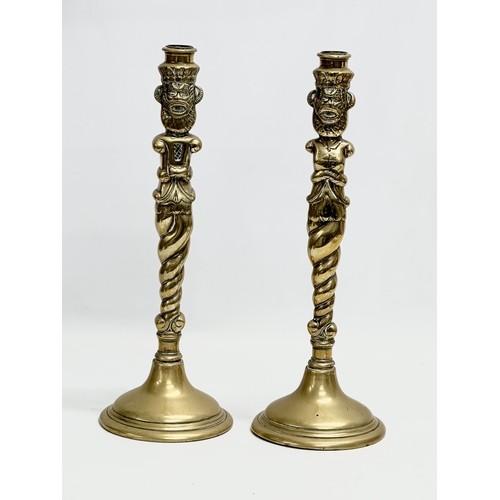 93 - A pair of large Victorian brass candlesticks. 35cm