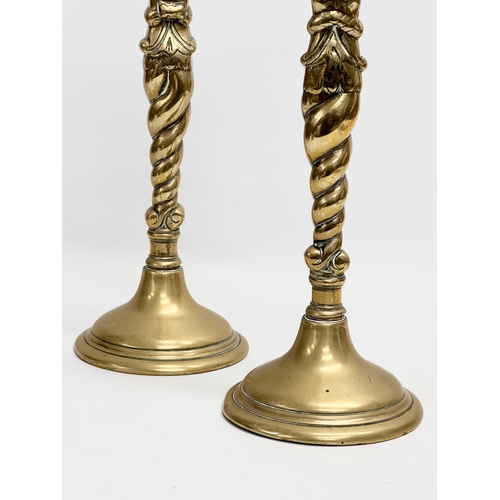 93 - A pair of large Victorian brass candlesticks. 35cm