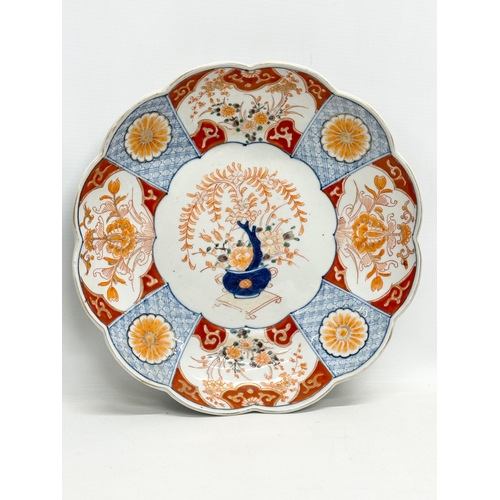 326 - A pair of large early 20th century Japanese Imari chargers/bowls. Late Meiji. Circa 1900. 31x5.5cm