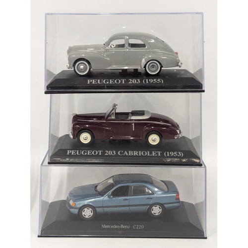 574 - A collection of model cars and motorbikes