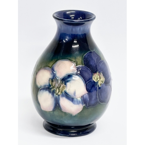 261 - A vintage signed Moorcroft ‘Clematis’ baluster vase. 12cm