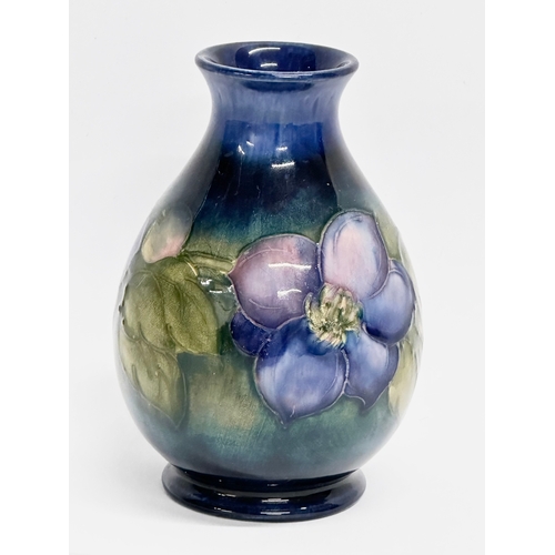 261 - A vintage signed Moorcroft ‘Clematis’ baluster vase. 12cm