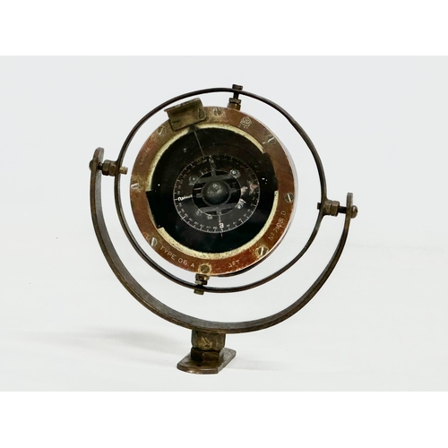 245 - An early 20th century Nautical Gimbal ships compass. Type 06 A. Stamped AM. 16x12x13cm