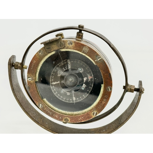 245 - An early 20th century Nautical Gimbal ships compass. Type 06 A. Stamped AM. 16x12x13cm