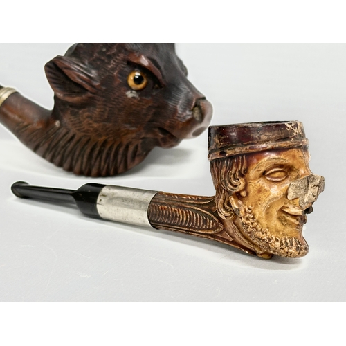 262 - 2 late 19th/early 20th century character smoking pipes. 15cm