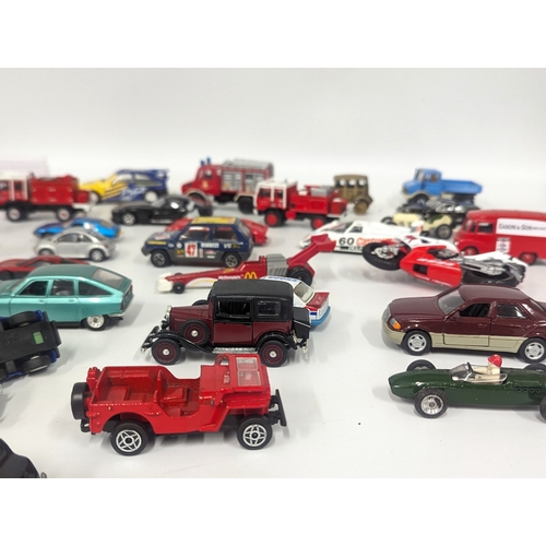 634 - A collection of model cars and trucks including Matchbox, Corgi, Solido, etc