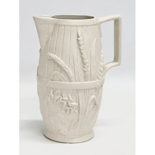 265 - 2 mid 19th century Copeland Parian Ware jugs. A Harvest Barrel jug 13x18cm.