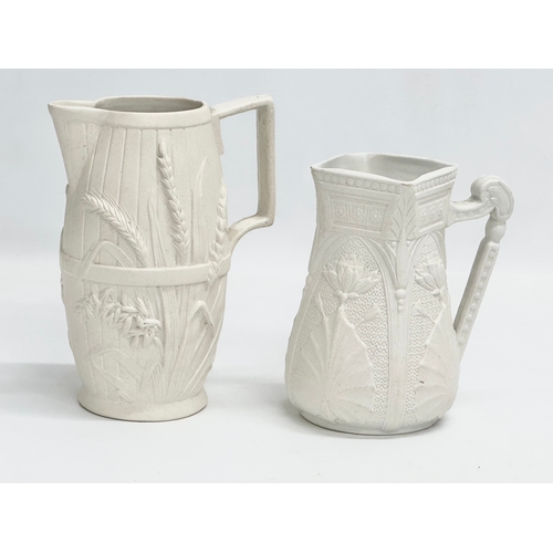 265 - 2 mid 19th century Copeland Parian Ware jugs. A Harvest Barrel jug 13x18cm.