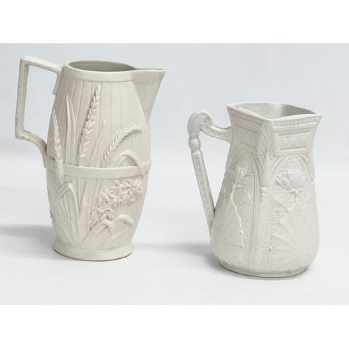 265 - 2 mid 19th century Copeland Parian Ware jugs. A Harvest Barrel jug 13x18cm.