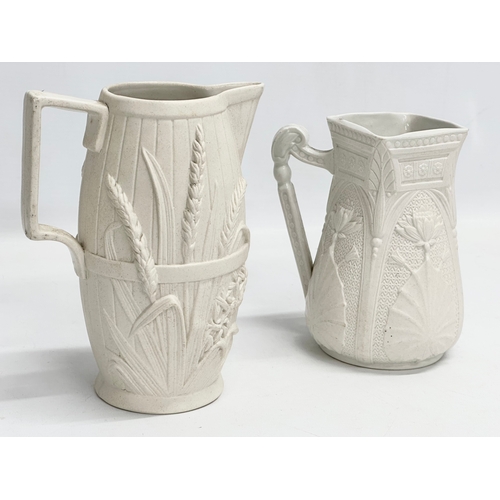 265 - 2 mid 19th century Copeland Parian Ware jugs. A Harvest Barrel jug 13x18cm.