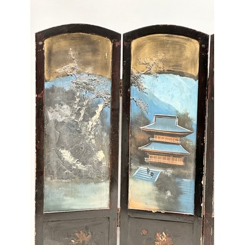 59 - A late 19th century Japanese hand painted 4 tier screen. With embossed trees, pagodas and figures. 9... 