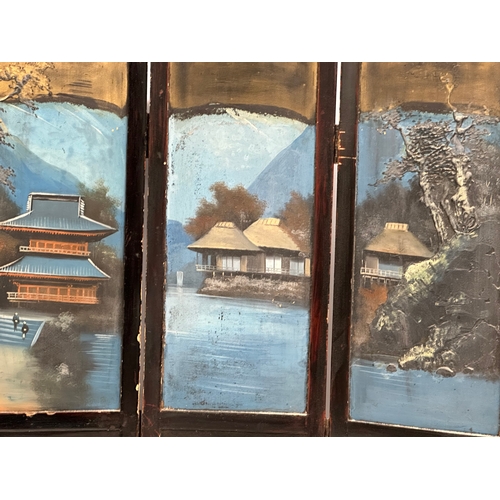 59 - A late 19th century Japanese hand painted 4 tier screen. With embossed trees, pagodas and figures. 9... 