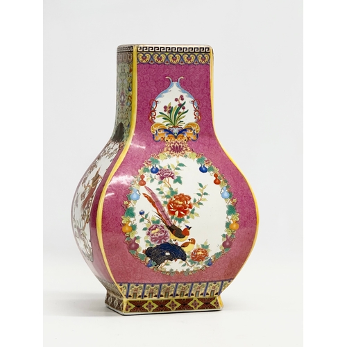 268 - A decorative Chinese enamelled pottery vase. 19x12x29cm