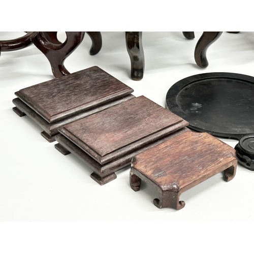 269 - A quantity of Chinese/Japanese wooden pot stands. Largest pair 29x29x21cm