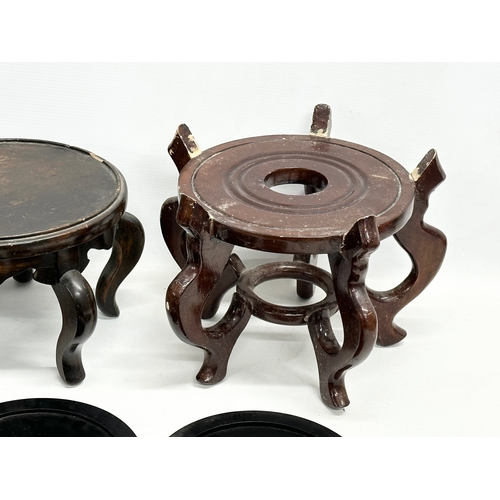 269 - A quantity of Chinese/Japanese wooden pot stands. Largest pair 29x29x21cm