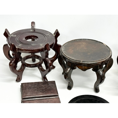 269 - A quantity of Chinese/Japanese wooden pot stands. Largest pair 29x29x21cm