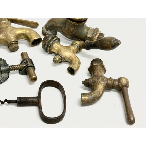 270 - A vintage Zodiac Rollover Corkscrew and 4 early 20th century brass taps