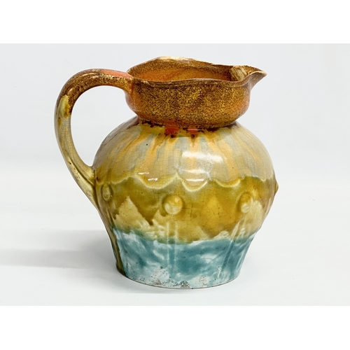 330 - A 1930’s English Art Deco glazed pottery jug. 18x21x19cm