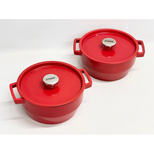 200A - A pair of Pyrex cast iron casserole dishes. 30x25x14cm