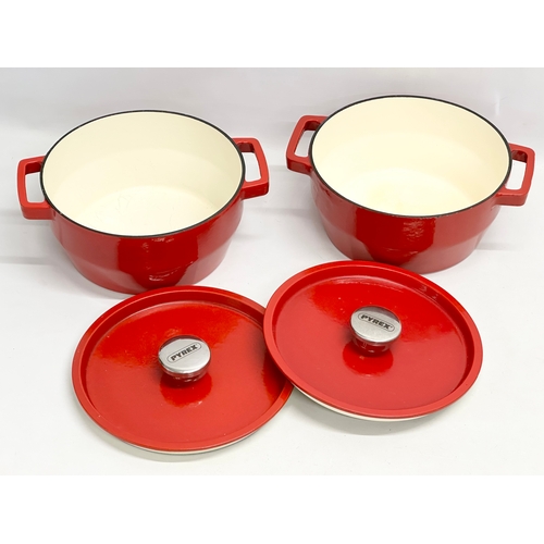 200A - A pair of Pyrex cast iron casserole dishes. 30x25x14cm