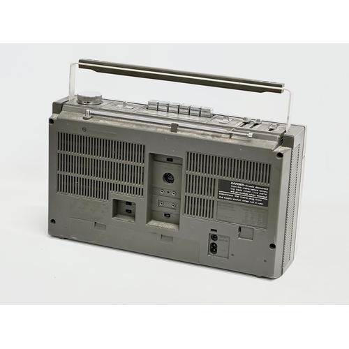 669 - A vintage Hitachi stereo cassette recorder. Model TRK-7100E.