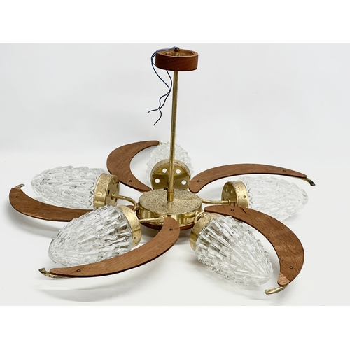 190D - A large 1960’s Mid Century teak and brass ceiling light fitting with 5 glass shades. 69x38cm