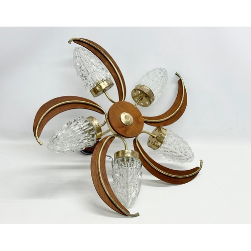 190D - A large 1960’s Mid Century teak and brass ceiling light fitting with 5 glass shades. 69x38cm