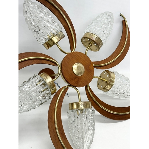 190D - A large 1960’s Mid Century teak and brass ceiling light fitting with 5 glass shades. 69x38cm