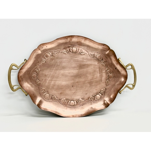 257 - An early 20th century Joseph Sankey & Sons Art Nouveau copper tray with brass handles. Circa 1900-19... 