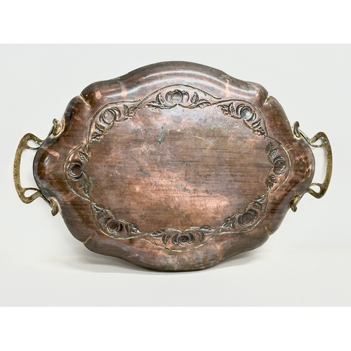 257 - An early 20th century Joseph Sankey & Sons Art Nouveau copper tray with brass handles. Circa 1900-19... 