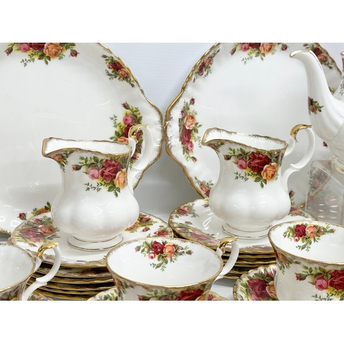 275C - A 47 piece Royal Albert ‘Old Country Roses’ tea service. 2 pairs of salt and pepper shakers. A teapo... 