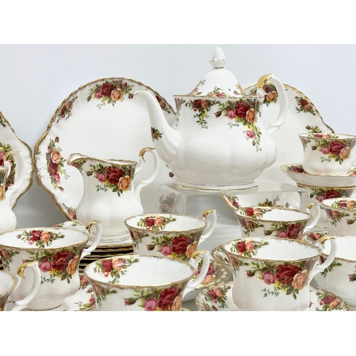 275C - A 47 piece Royal Albert ‘Old Country Roses’ tea service. 2 pairs of salt and pepper shakers. A teapo... 