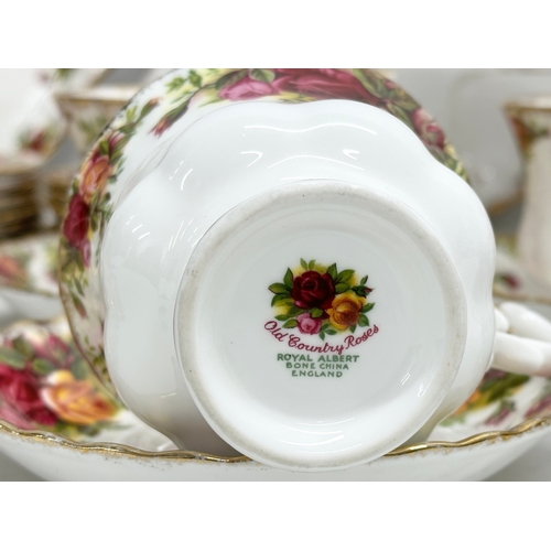 275C - A 47 piece Royal Albert ‘Old Country Roses’ tea service. 2 pairs of salt and pepper shakers. A teapo... 