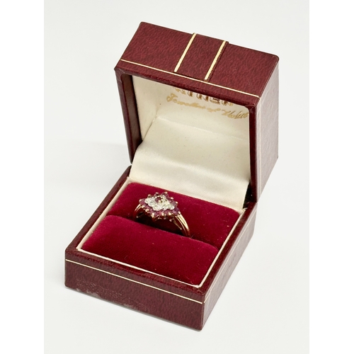 494 - A 9ct gold and diamond ring with case. Size O.