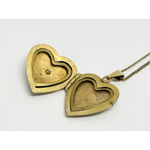 508 - A vintage rolled gold locket necklace. 24cm closed.