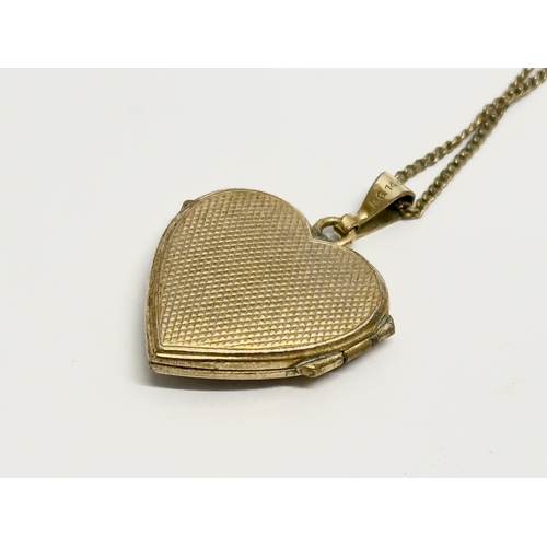 508 - A vintage rolled gold locket necklace. 24cm closed.