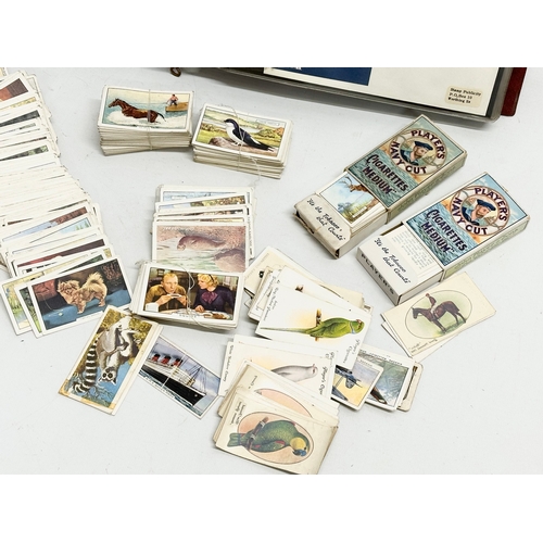 529 - A collection of vintage cigarette cards and British Military themed Classic One Cover Album.