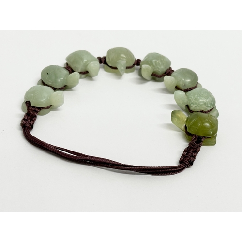 526 - A Chinese Jade bracelet. 10.5x9cm