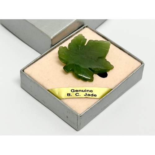 527 - A vintage Pan Pacific Jade brooch with box.  Brooch measures 3x3.5cm