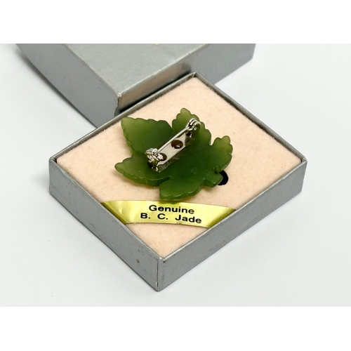 527 - A vintage Pan Pacific Jade brooch with box.  Brooch measures 3x3.5cm