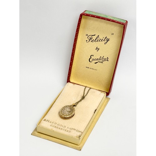 515 - A vintage rolled gold locket necklace with box. 23.5cm closed.