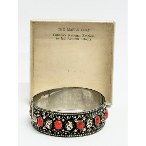 520 - An ornate Italian silver bangle. Stamped Alp, Italy. 6.5x6cm