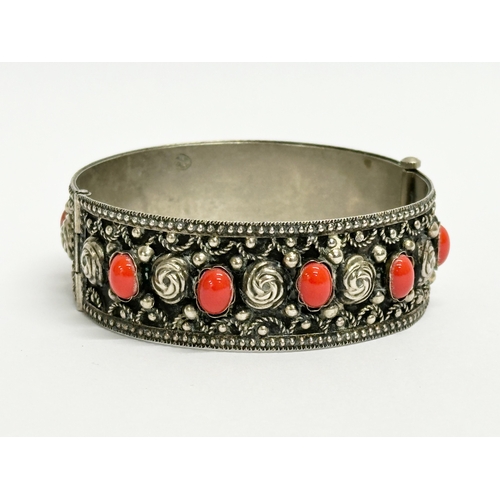 520 - An ornate Italian silver bangle. Stamped Alp, Italy. 6.5x6cm